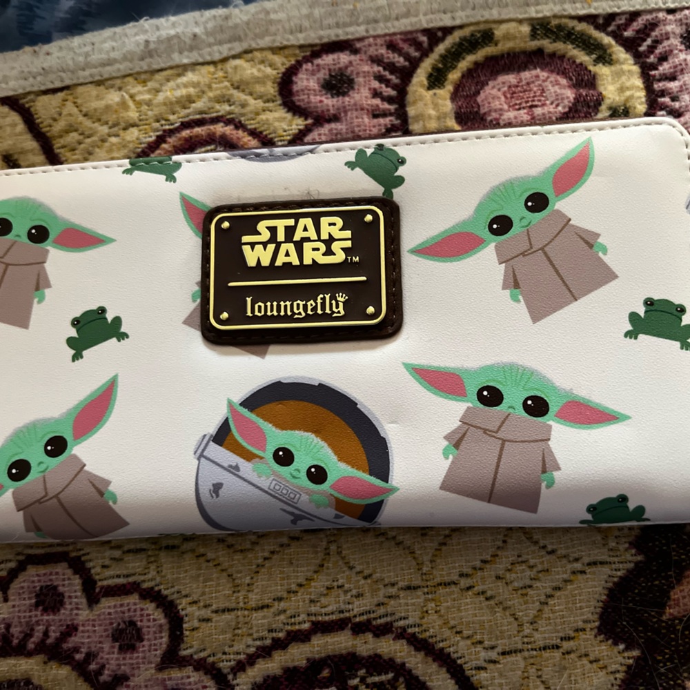 Brand new Mandalorian loungefly wallet. Original tag is still on it $45.
